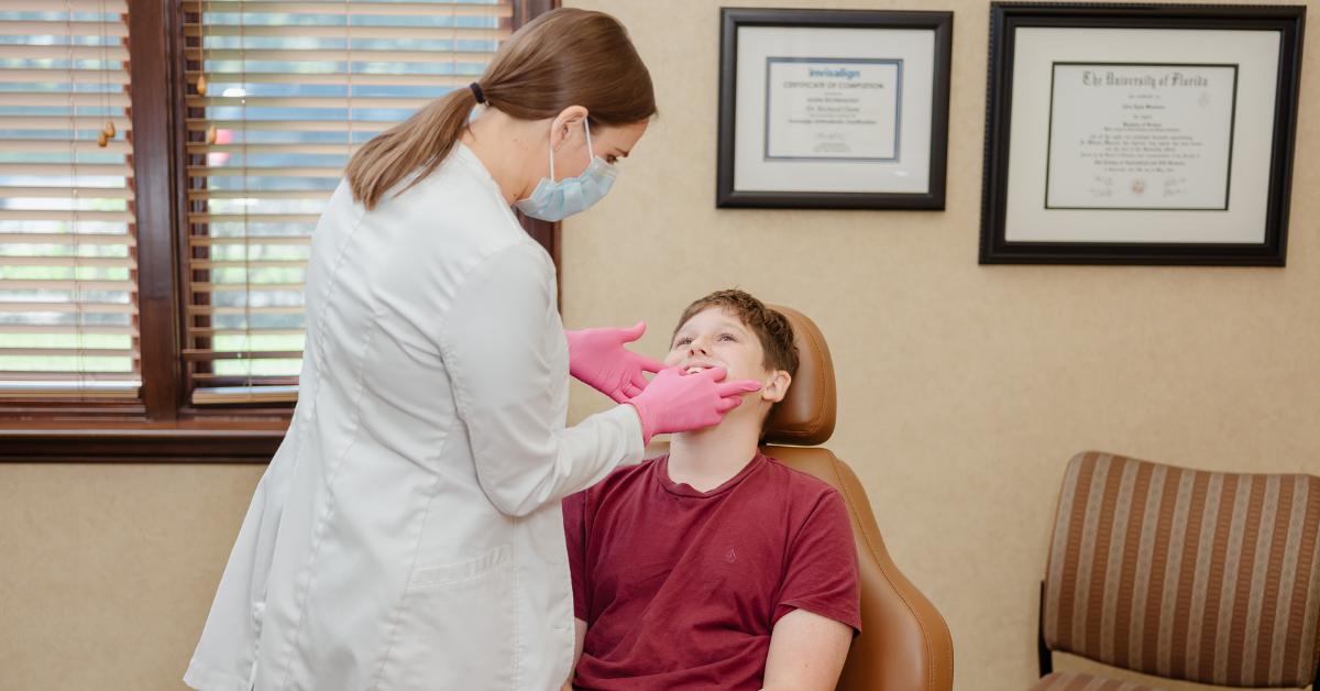 Dr. Wiewiora examines patient at orthodontic exam